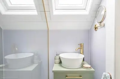 a white bathroom with a sink and a mirror at South Barlogan Farm in Bridge of Weir
