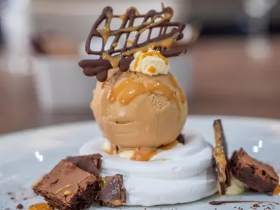a dessert with chocolate and ice cream on a white plate at Blackbull hotel in Tarbolton