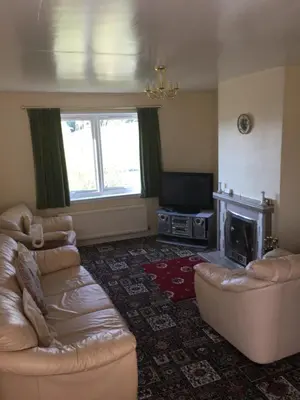 a living room with a couch and a television at Lavender Cottage with Parking and Beautiful Views Christmas Special in Carsphairn