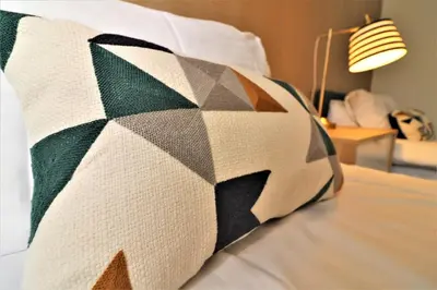 a close up of a quilt on a bed at Signature - Troon View in East Kilbride
