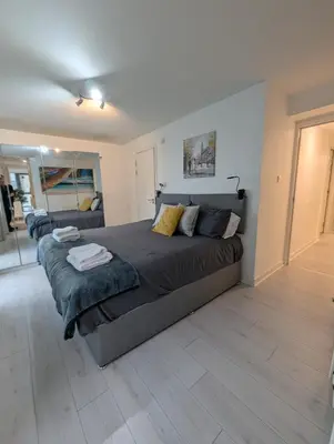 a bedroom with a large bed in a room at Glasgow City Centre Waterfront Apartment in Glasgow