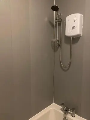 a shower in a bathroom with a sink at Nairoo in Balloch