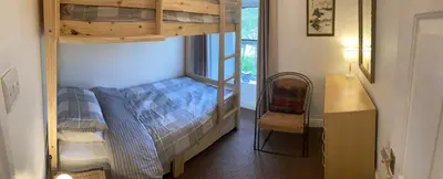 a small bedroom with a bunk bed and a desk at Park side Cottage, Number 2, The Morays in Blackford