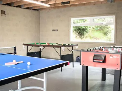 two ping pong tables in a ping pong room at The Grooms Cottage in Mauchline