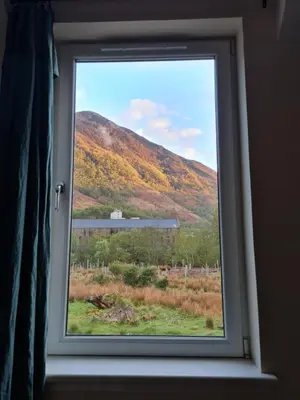 a window with a view of a mountain at Forest View Guesthouse, Kinlochleven WHW in Kinlochmore