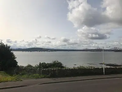 a view of a large body of water with a bridge at 1 Bed Studio - Sleeps 4 - Parking - Wifi in Saint Davids