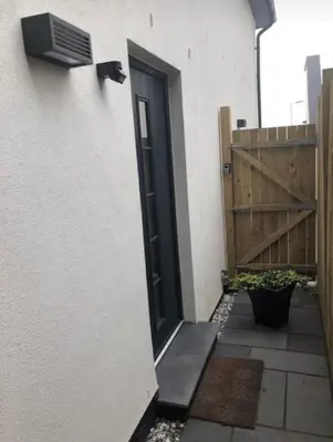 a door on the side of a building at 1 Bed Studio - Sleeps 4 - Parking - Wifi in Saint Davids