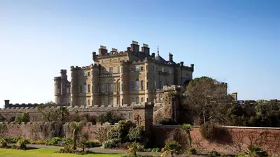 a large castle on top of a hill at Kincraig Apartment in Ayr