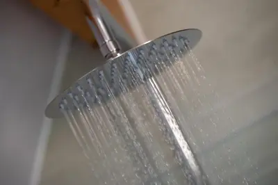 a shower head with a strainer in a bathroom at Bonnie Barns - Adults Only Luxury Lodges with hot tubs in Luss