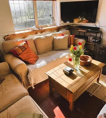a living room with a couch and a coffee table at North Lodge Kilmun in Kilmun