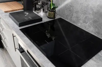a kitchen counter with a black sink in a kitchen at Beautiful 4 bed flat in perfect central location in Glasgow