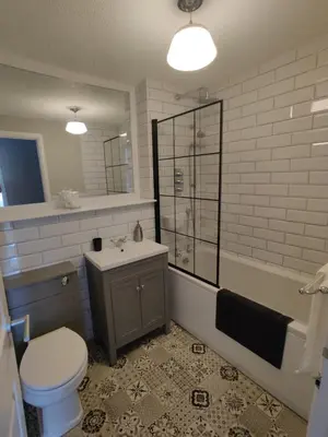 a bathroom with a toilet and a sink and a shower at Anchors Away in Ayr