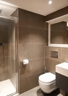 a bathroom with a toilet and a shower at The Auld Kirk & Spa in Stirling