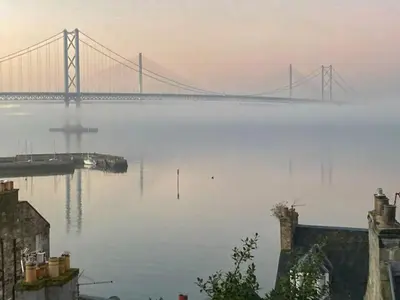a large bridge over a large body of water at Forth Reflections in Queensferry