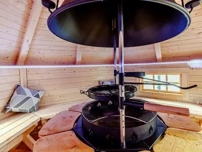 a stove with two pots and pans in a cabin at Golden Crown exclusive use spa venue in Tarbolton