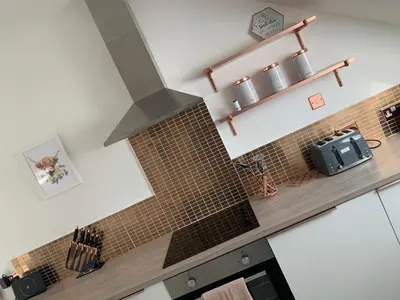 a kitchen with a brick stove in a kitchen at The Clachan Flat in Rosneath