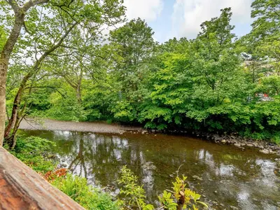 a river with trees on the side of it at Dalgarven Spa House in Dalry
