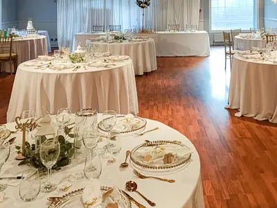 a room filled with tables with white table settings at Dalgarven Spa House in Dalry
