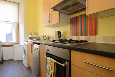 a kitchen with a stove and a stove top oven at Keek Oot at 73 in Gourock