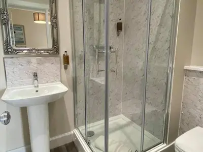 a bathroom with a shower and a sink at The Inn At Charlestown in Dunfermline