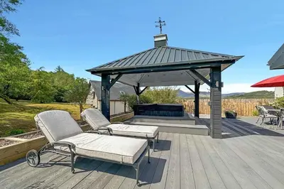 a gazebo with two chairs and a bench on a deck at Little Fox Lodge Luxury Hideaway with Hot Tub Glencoe Near Fortwilliam in Glencoe