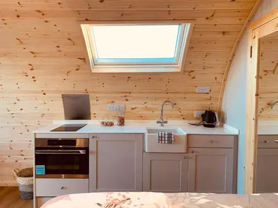 a kitchen with a sink and a window at The Stag Pod Farm Stay with Hot Tub Sleeps 2 in Galston