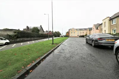 a car parked on the side of a street at Macintosh lower in Bellshill