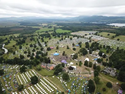 an aerial view of a park with tents and cars at Cardross Estate Glamping Pods in Stirling
