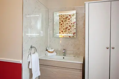a bathroom with a sink and a mirror at Hawthornbank in Oban