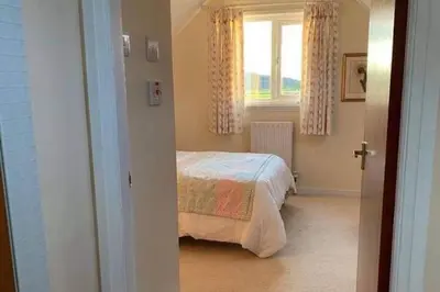 a bedroom with a bed and a window at 1 Bed House - Central Free Parking Wifi in Stirling