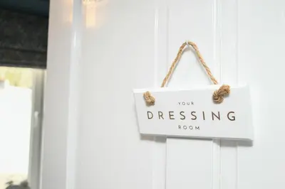 a sign that reads dressing hanging on a door at The Gallery Apartment - Spacious, Town Centre, Walkable to Ferry Terminal, in Oban