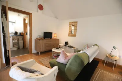 a living room with a couch and two chairs at Garden Studio in Biggar in Biggar