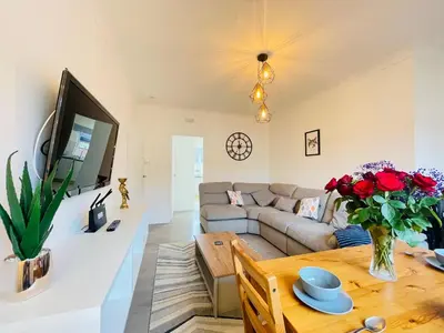 a living room with a couch and a table at Cardonald Central in Glasgow