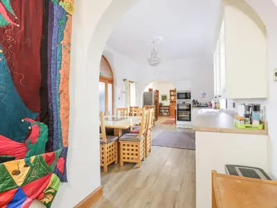a kitchen and dining room with a table and chairs at Torview House in Peebles
