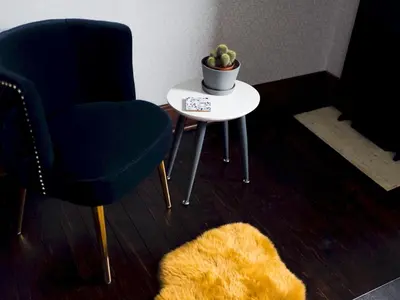 a room with two chairs and a table with a plant at Beautiful, traditional 2 bed flat w free parking - Pass the Keys in Glasgow