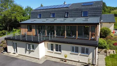 an aerial view of a house with a solar roof at Mingulay, Cuil Bay in Appin