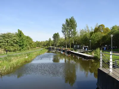 a river with several boats on it at Bumbles Barn in Slamannan