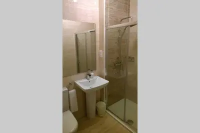a bathroom with a shower and a sink and a toilet at Old Town 163 in Edinburgh