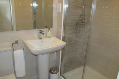 a bathroom with a sink and a shower at Old Town 163 in Edinburgh