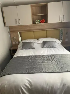 a large bed with two pillows in a bedroom at The Castleton Sea View 13 in Dunoon