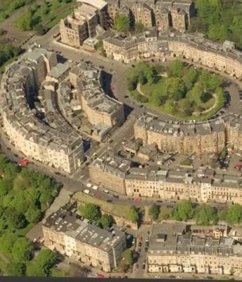 an aerial view of a city with many buildings at Perfect In The Park in Glasgow