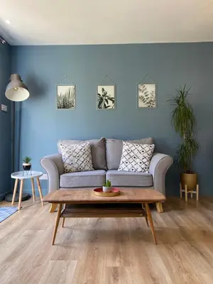 a living room with a couch and a coffee table at Lynwood Studio in Oban
