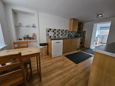 a kitchen with a table and a counter top at ALLARDYCE in Kincardine