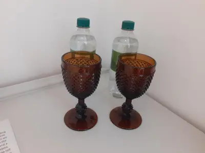 two bottles of water and two vases on a table at THE BOTHY SUITE BY TEMPLE WOOD in Lochgilphead