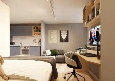 a bedroom with a bed and a desk with a computer at Silk Mill Edinburgh in Edinburgh