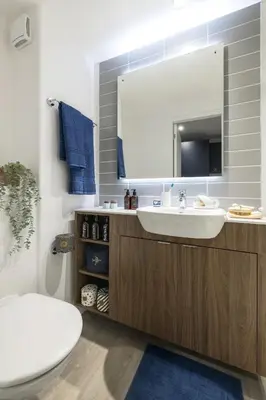 a bathroom with a sink and a mirror at Silk Mill Edinburgh in Edinburgh