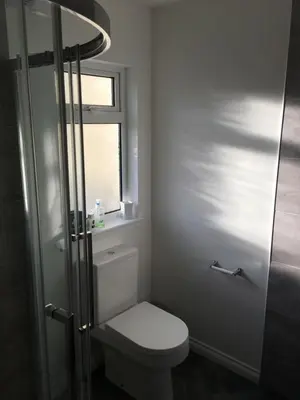 a bathroom with a toilet and a window at Brecbennoch in Oban