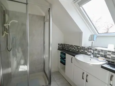 a bathroom with a shower and a sink at Upper Brackendale in Taynuilt