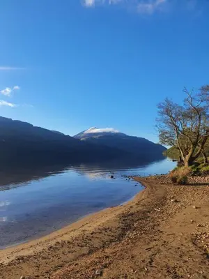 a view of the shore of a lake at Stable Cottage in Arrochar