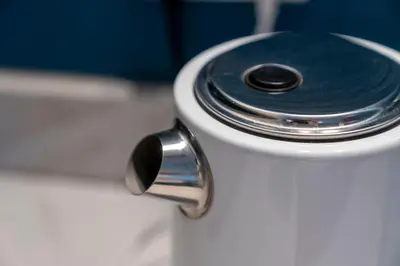 a close up of a toilet with a black lid at Saughton Suite with views of Water of Leith in Edinburgh